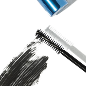 Eyeko 8ml tube beside a coin for clear size and travel-friendly benefit