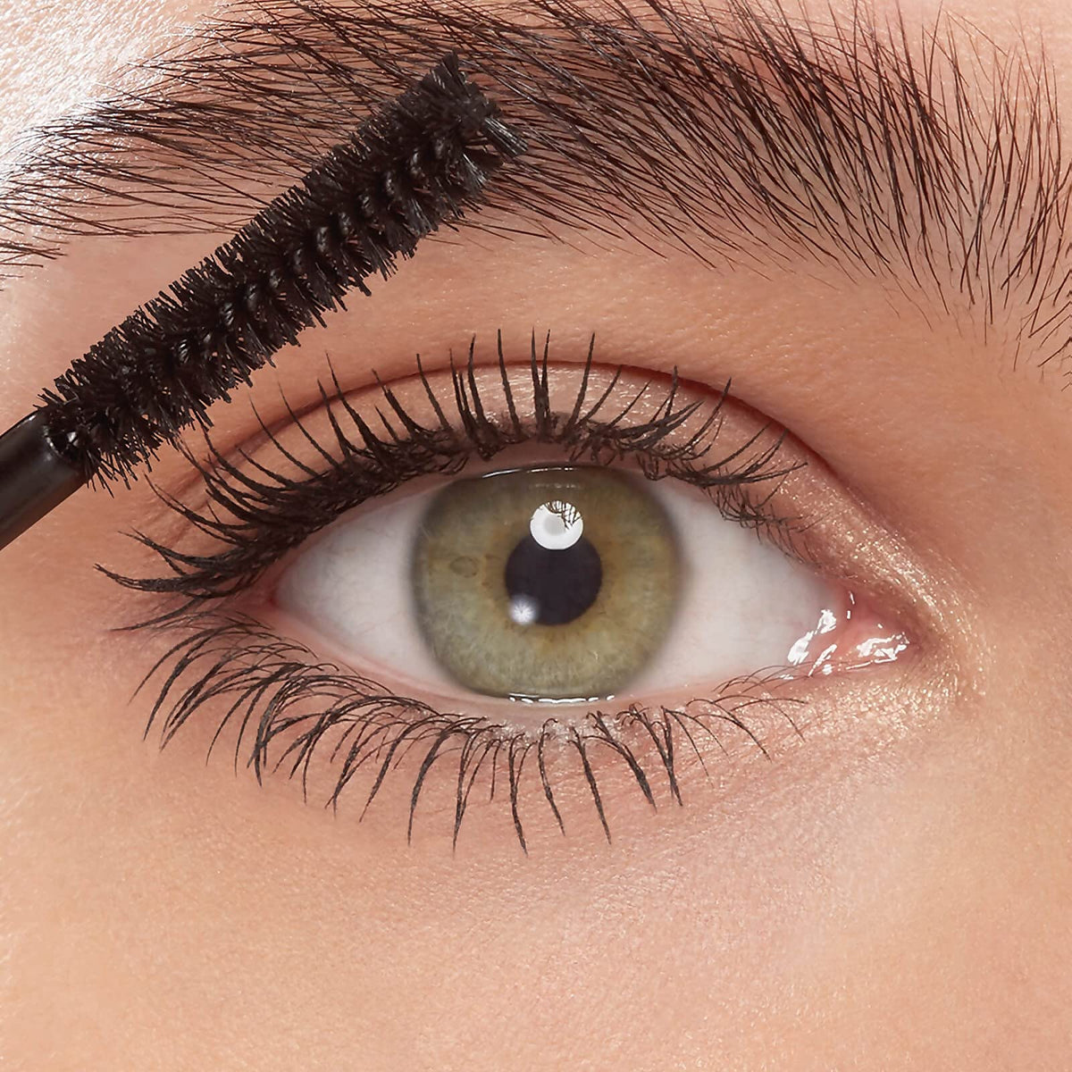 Eyeko mascara texture swirl showing fibre-enhanced formula with coconut oil and fruit extracts benefit conditioning