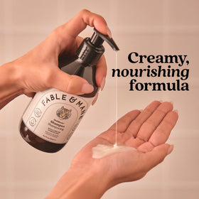 Fable & Mane bottle in hand to show size and scale for shopping clarity