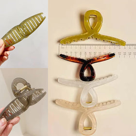 FAELBATY clip holding a full high bun to show secure all-day wear
