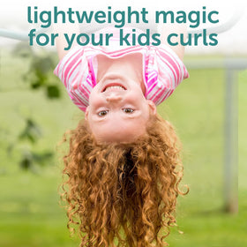 Child using Fairy Tales Curly-Q spray with parent styling for faster morning routines
