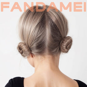 Fandamei child wearing a ballet bun showing neat stage-ready styling benefit