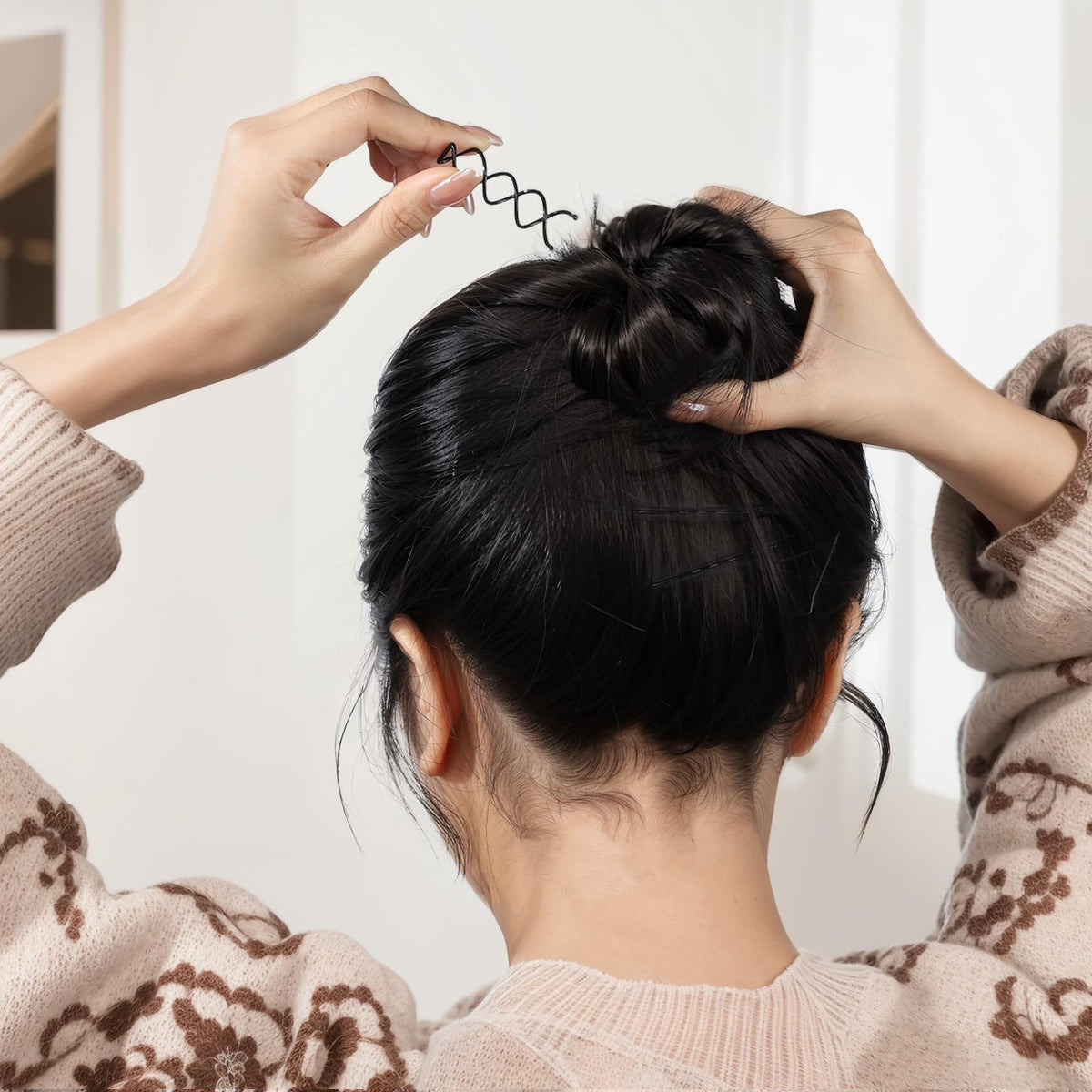 Fandamei pins inserted in a bun illustrating firm all-day hold and discreet look