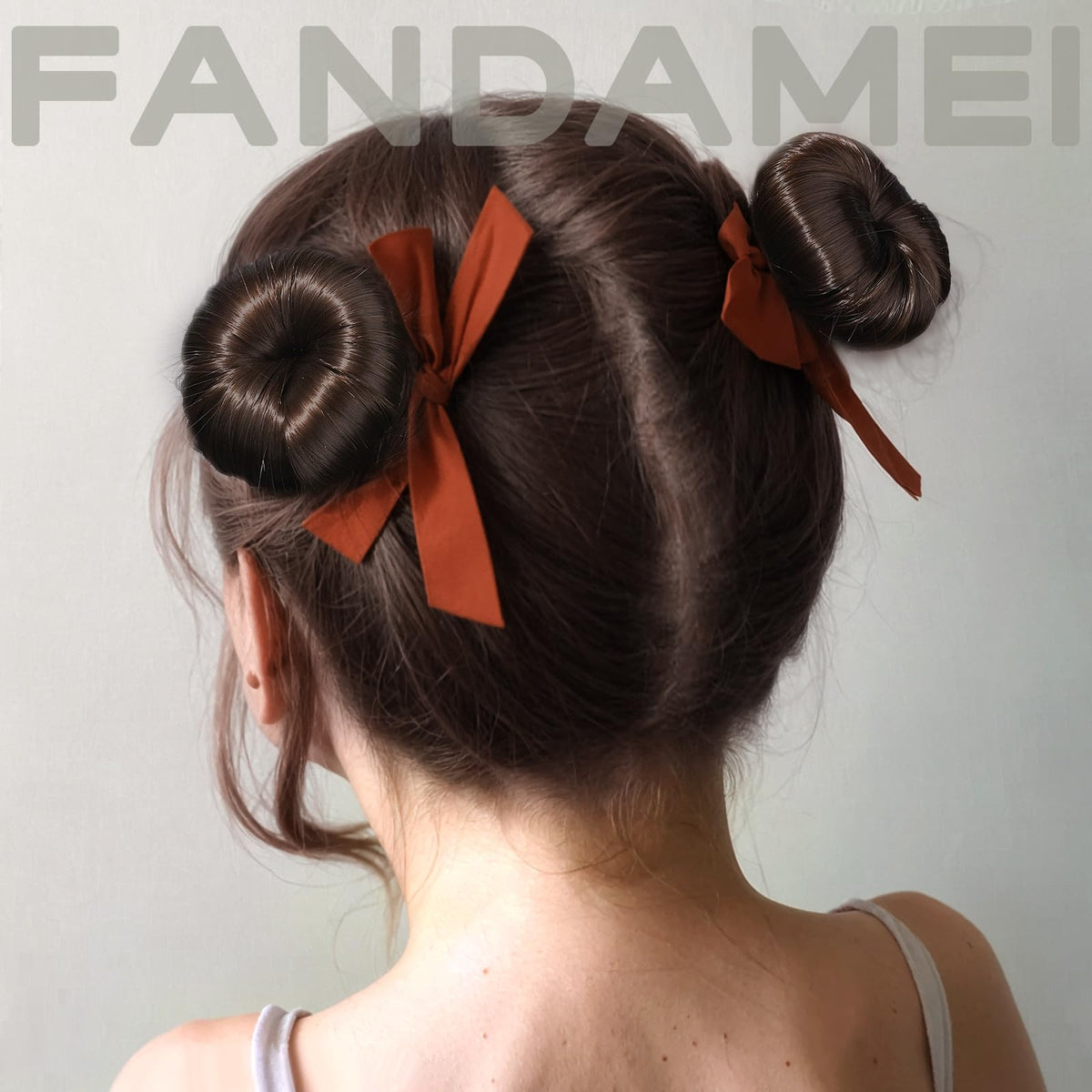 Fandamei donut beside a hand to show compact size and easy handling