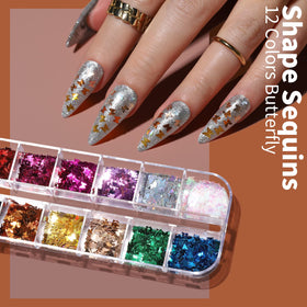 FANDAMEI adhesive nail stickers and curved tweezers arranged for easy placement