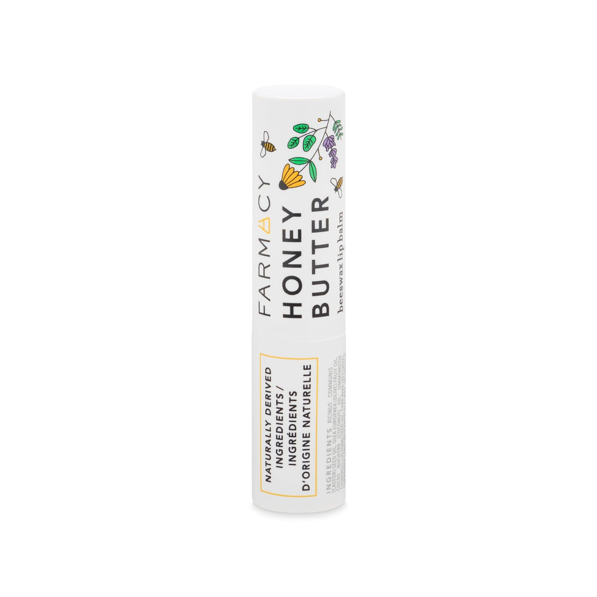 Farmacy beeswax lip balm next to coin showing 3.4g size for portability
