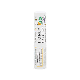 Farmacy beeswax lip balm next to coin showing 3.4g size for portability