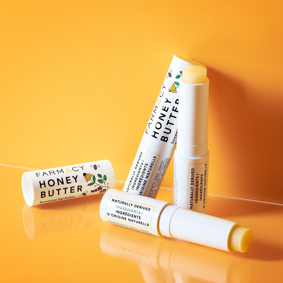 Farmacy beeswax lip balm creamy texture close-up for smoothing benefit