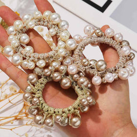Fashey close-up of smooth pearls and stitching, detail shows durable craftsmanship benefit