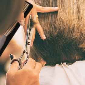 Fcysy scissors in hand showing scale and ergonomic grip for reduced fatigue benefit