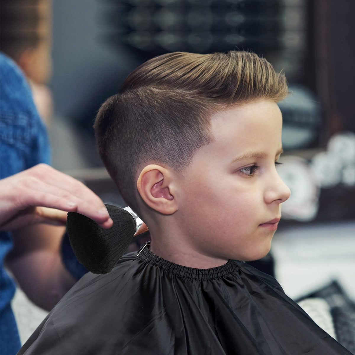 FEBSNOW cape in use on a client at a barber station protecting clothing