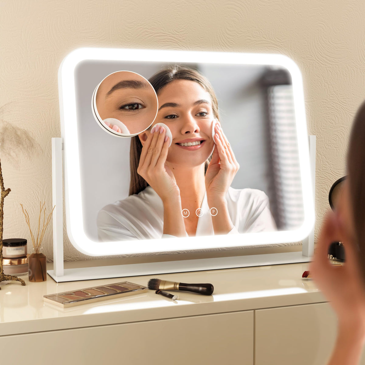 FENNIO mirror on vanity beside makeup items showing compact size benefit