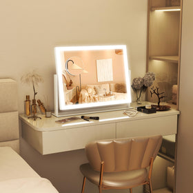 FENNIO mirror beside a hand for scale showing compact 13 by 17 inch size for small counters