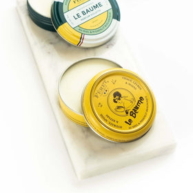 Feret Parfumeur balm applied to lips demonstrating hydration and softened finish benefit: smooth lips