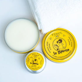 Feret Parfumeur tin peeking from a handbag lifestyle shot showing everyday portability benefit: ready on-the-go