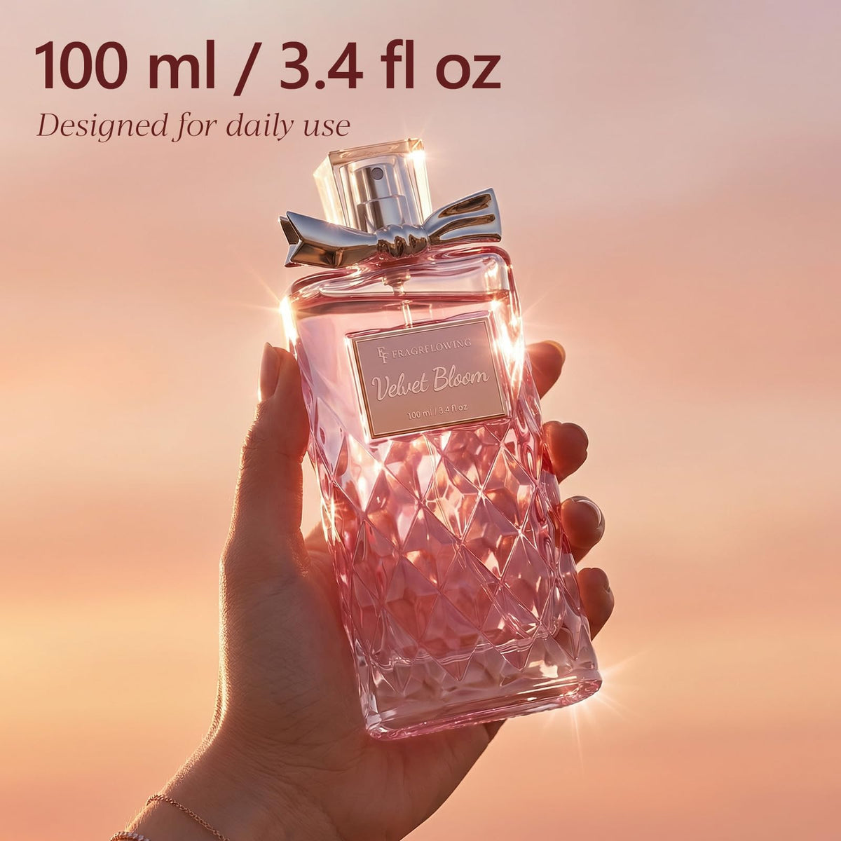 FF FRAGRFLOWING bottle next to hand for size and 100ml scale reference