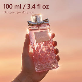 FF FRAGRFLOWING bottle next to hand for size and 100ml scale reference