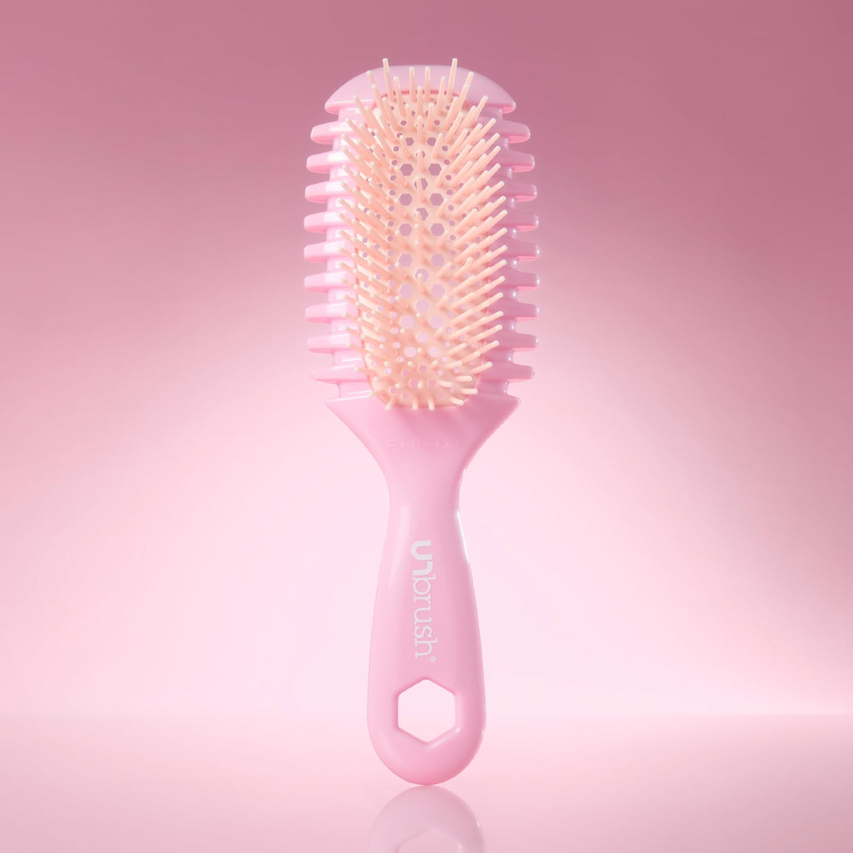 FHI Heat brush being used on wet hair to reduce breakage and ease tangles