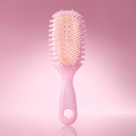 FHI Heat brush being used on wet hair to reduce breakage and ease tangles
