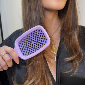 FHI Heat UNbrush bristle close-up showing DuoFlex dual-length design and gentle detangling