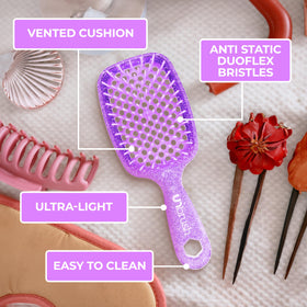FHI Heat UNbrush in hand scale comparison showing 1.5 oz lightweight feel for effortless brushing