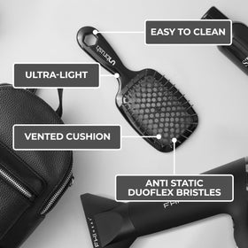 FHI Heat UNbrush held in hand to show lightweight 1.5 oz design and ease of use