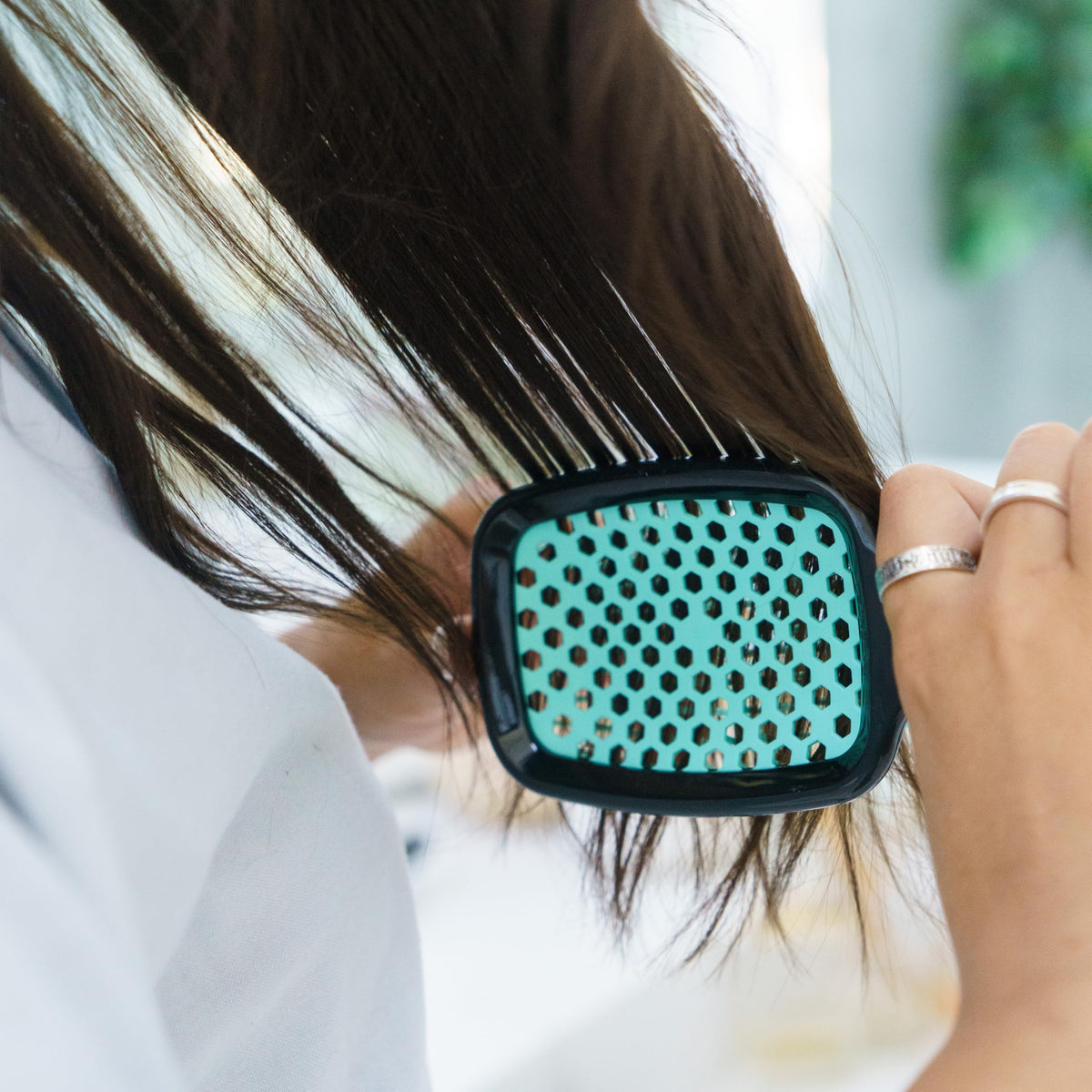 FHI Heat UNbrush on bathroom counter in lifestyle setting for everyday grooming convenience