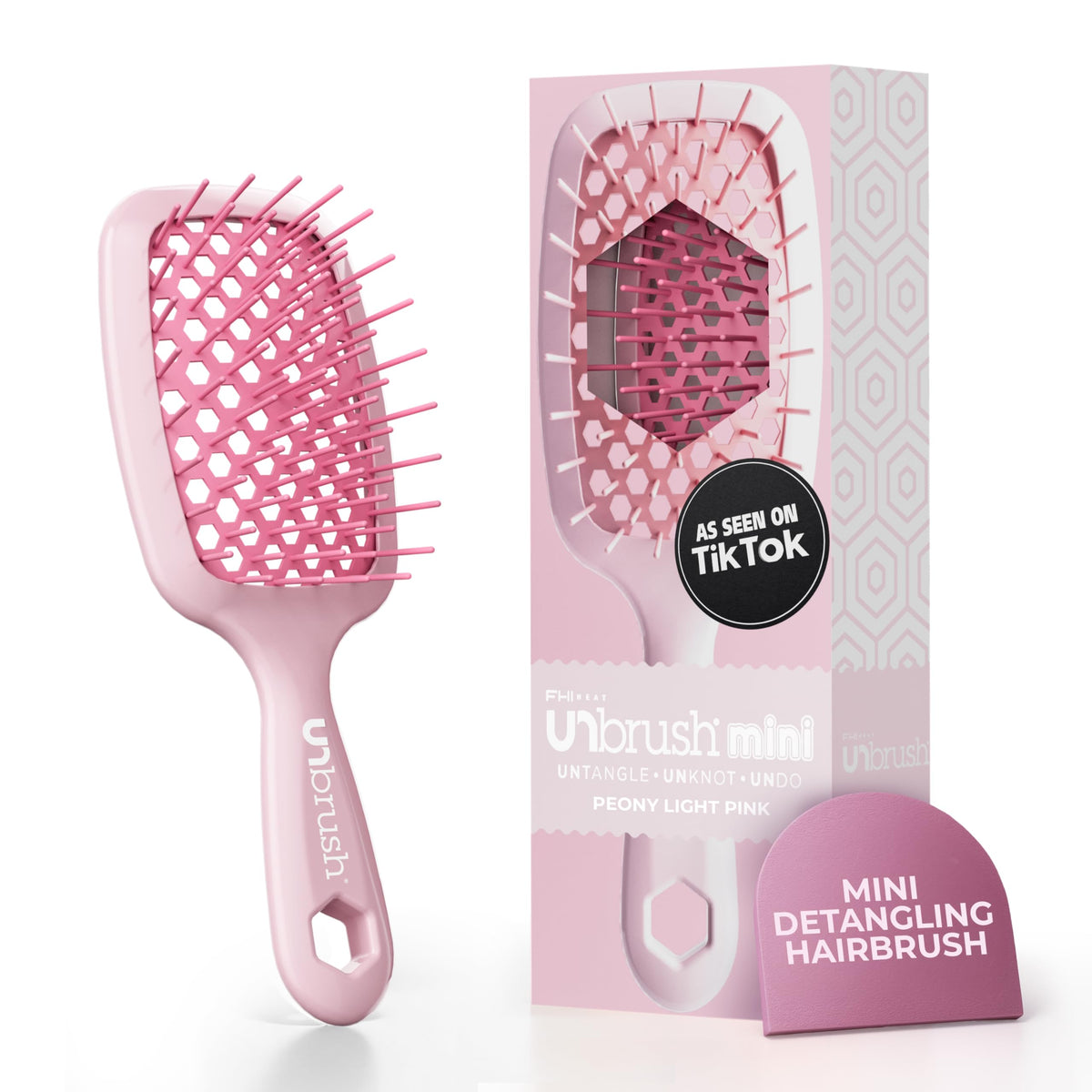 FHI Heat UNbrush Mini front view showing compact design and peony pink color for travel convenience