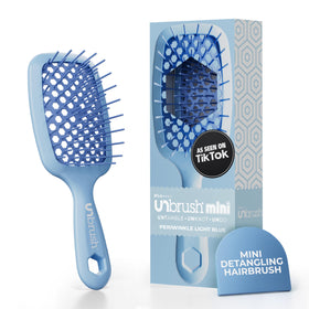 FHI Heat UNbrush Mini front view showing compact periwinkle brush and travel-ready design