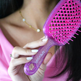 FHI Heat UNbrush packed in travel bag, compact design for on-the-go styling
