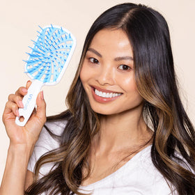 FHI Heat UNbrush Plus packed in travel bag for on-the-go detangling convenience