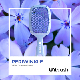 FHI Heat UNbrush on bathroom counter styled for travel-ready convenience