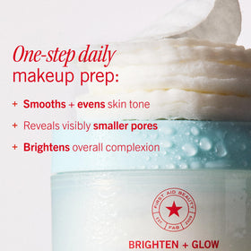 First Aid Beauty pads in hand showing scale and single-use convenience