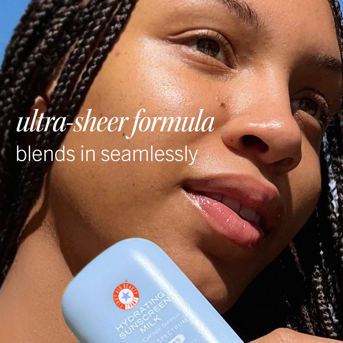 First Aid Beauty applying sunscreen milk to skin for invisible, non-greasy protection