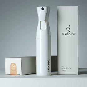 FLAIROSOL being refilled from a bottle showing easy reuse and waste reduction benefit