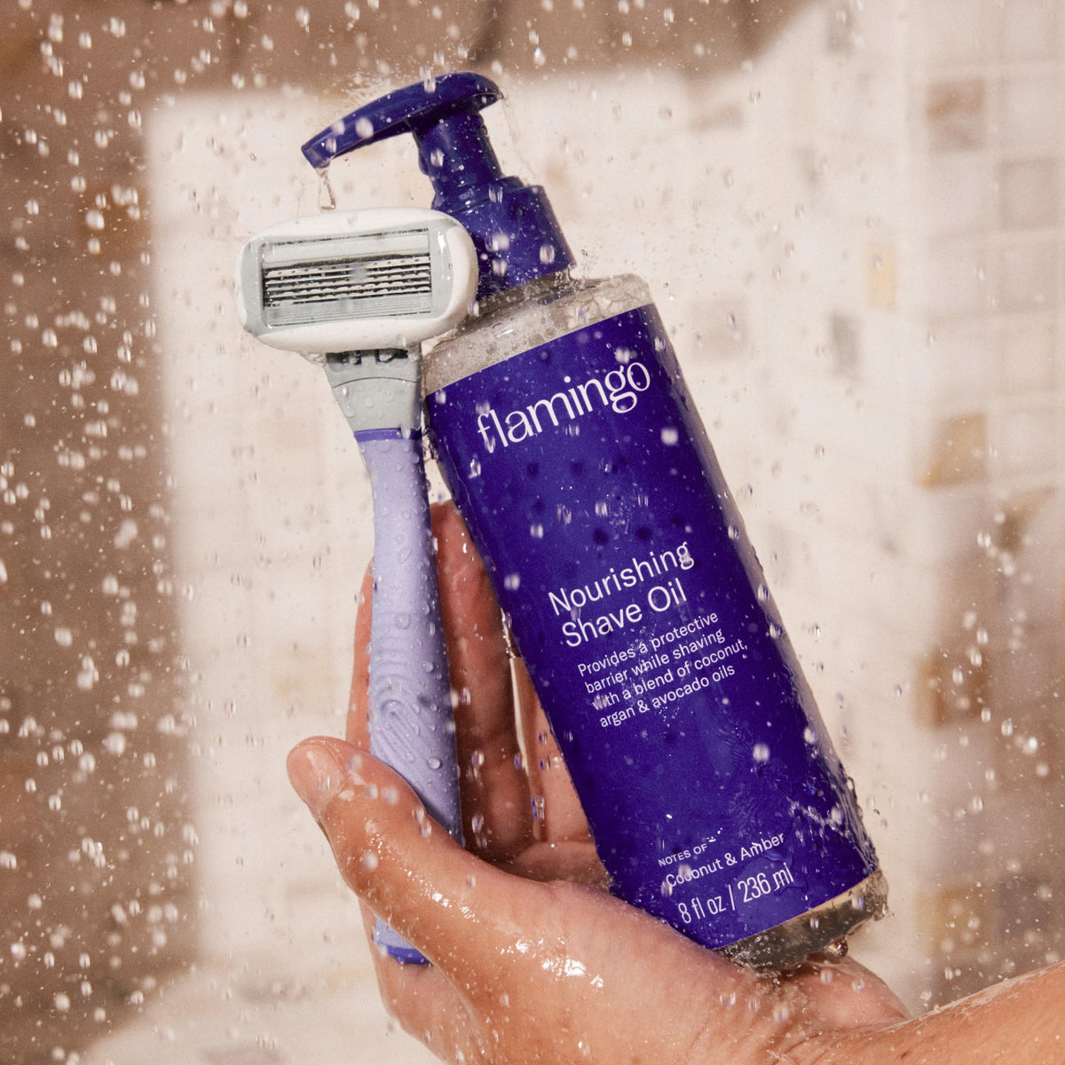 Flamingo bottle next to razor and towel showing shaving routine convenience