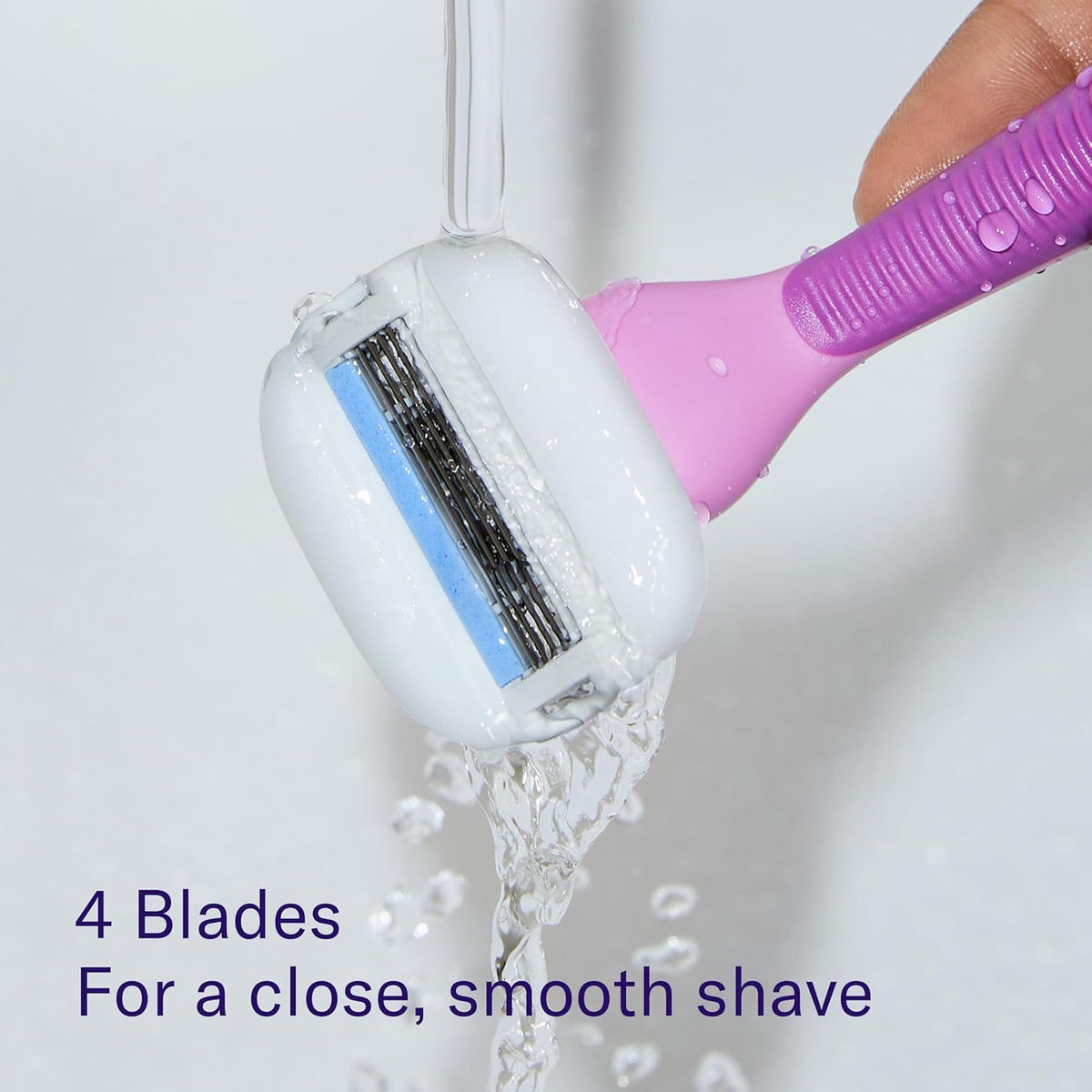 Flamingo razor beside coin for scale, illustrates compact size and portability