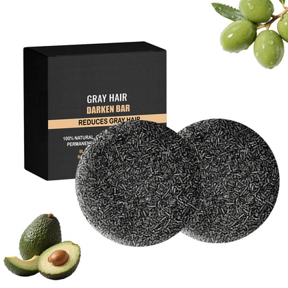 Flomitta front packaging showing black soap bar and benefits