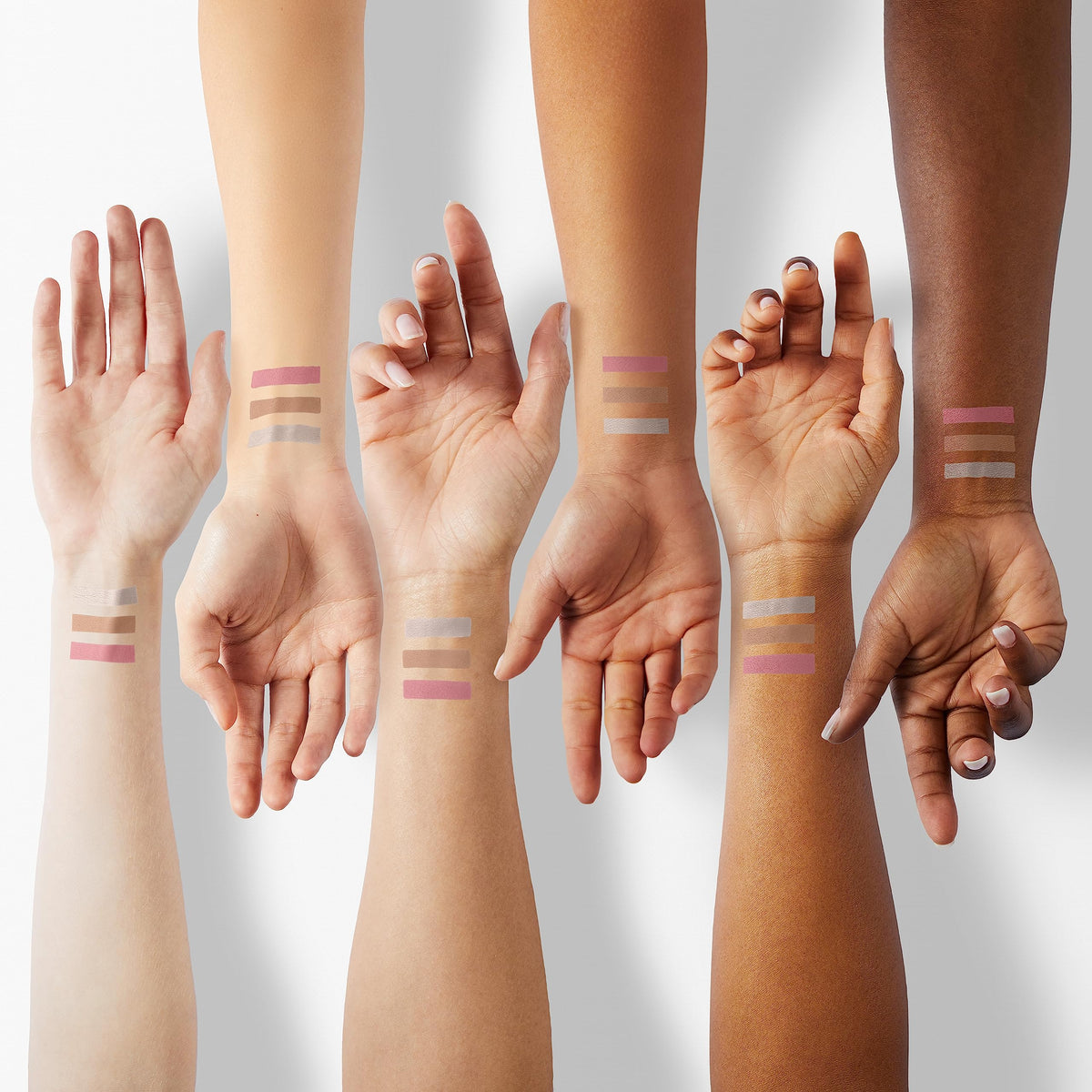 FOCALLURE swatches of highlighter bronzer blush on arm for shade guide