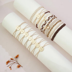 Fohufo hair tie beside a coin showing scale and portability benefit