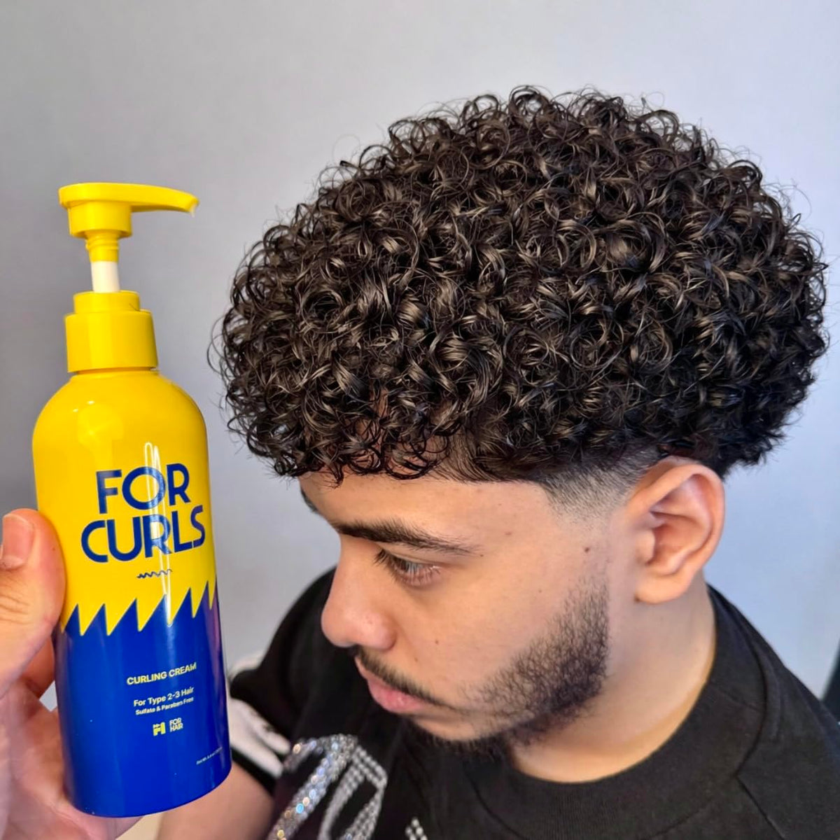 FOR CURLS size and scale next to hand illustrating the 8.4 oz jar capacity for value perception