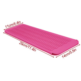 Fouews mat in use under a straightener protecting countertop from heat