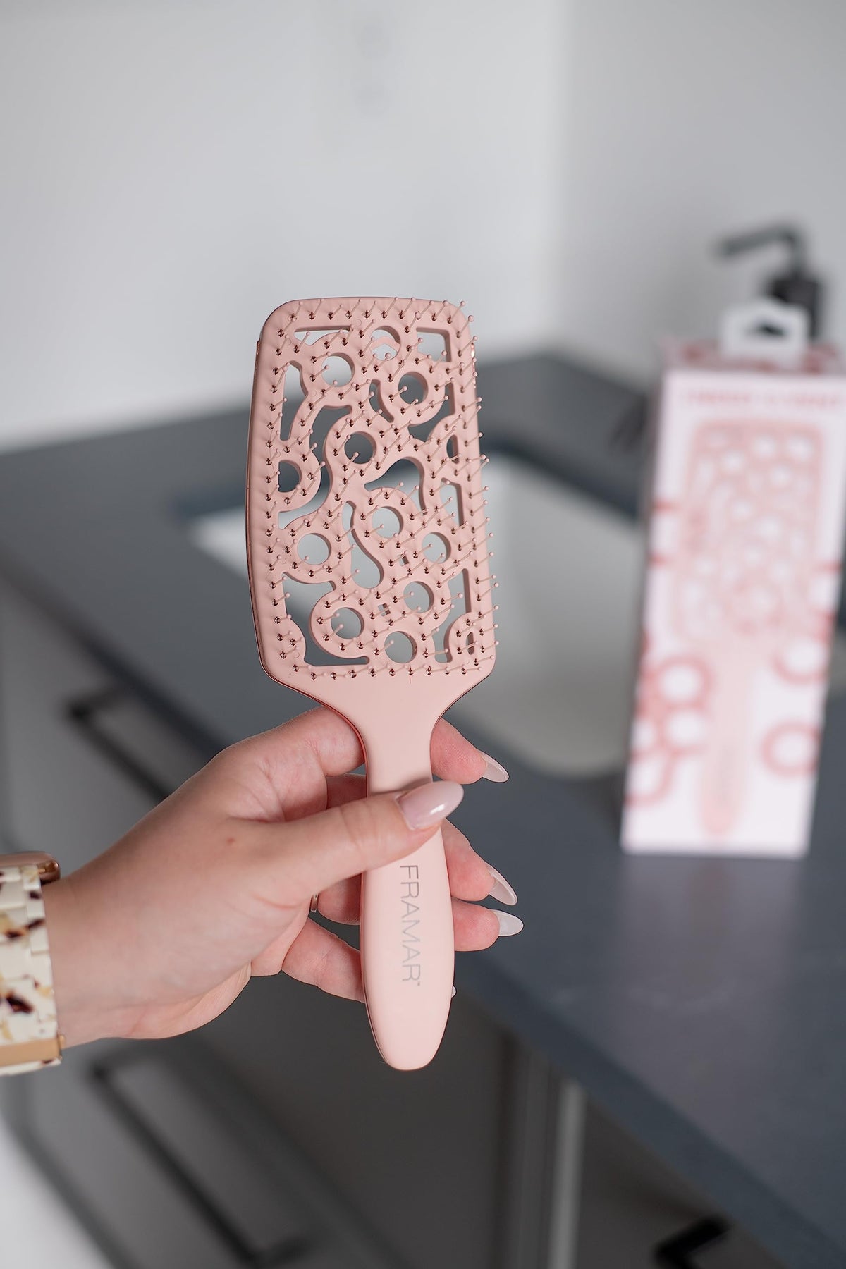 FRAMAR brush used with blow dryer illustrating faster drying benefit