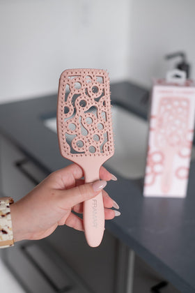 FRAMAR brush used with blow dryer illustrating faster drying benefit
