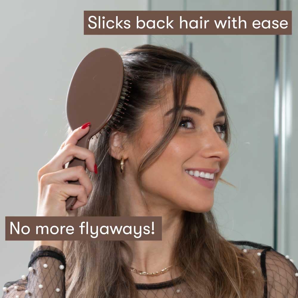 FRAMAR brush held in hand showing scale and comfortable ergonomic handle