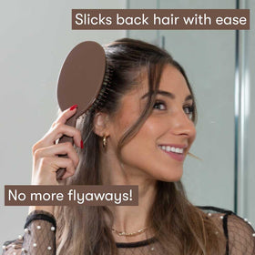 FRAMAR brush held in hand showing scale and comfortable ergonomic handle