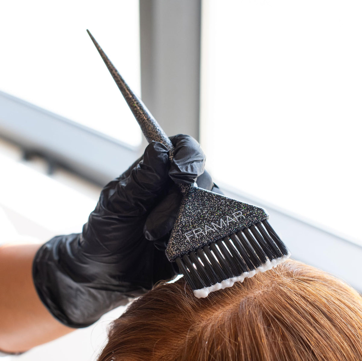 FRAMAR brushes held in hand showing size and ergonomic control