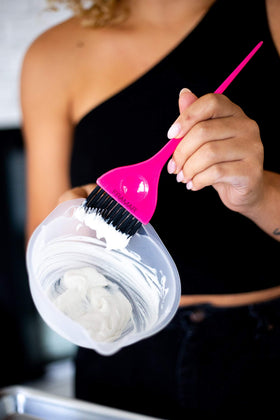 FRAMAR bowl in use with brush mixing hair color for efficient application