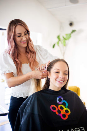 FRAMAR clip in stylist hands sectioning hair for precise, efficient styling