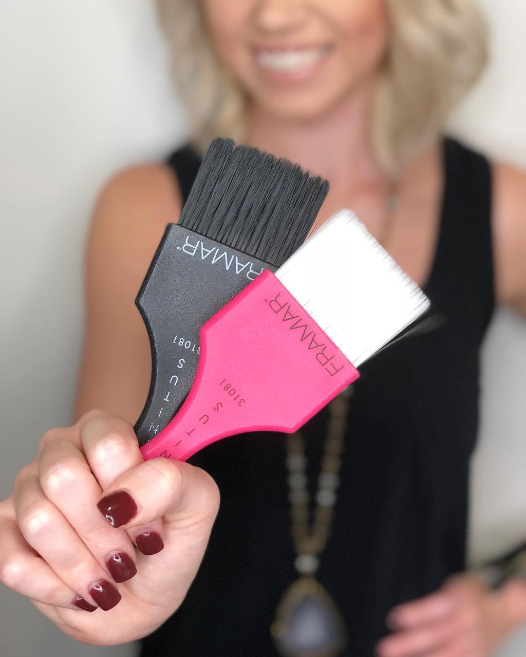 FRAMAR brush applying color freehand on hair illustrating faster balayage application